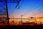 The silhouette of the evening electricity transmission pylon